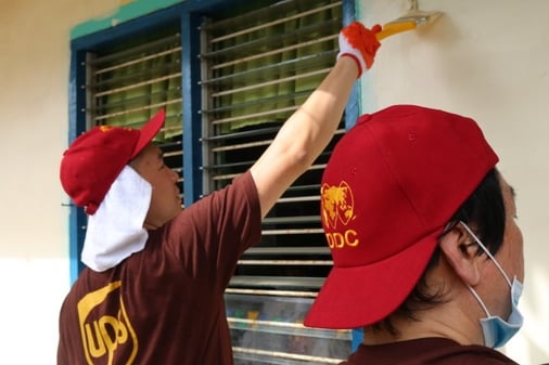 DDC employees repainting an elementary school